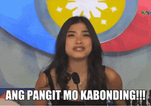 a woman speaking into a microphone with the words ang pangit mo kabonding