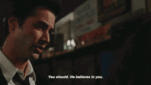 a man in a suit and tie is saying you should he believes in you