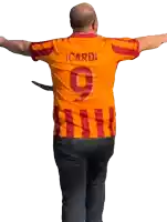 a man wearing an orange and red shirt with the number 9 on the back