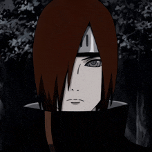 a close up of a person 's face with a black hood