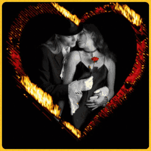 a black and white photo of a man and woman kissing with vica written on the bottom right corner