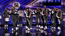 marching band americas got talent performance on stage playing music