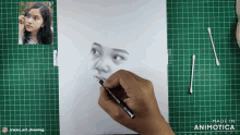 a drawing of a girl 's face is being made by animatica