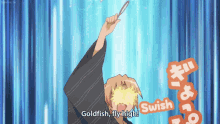 a man in a kimono is holding a goldfish and says goldfish fly high