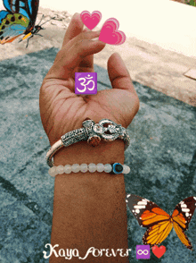 a person 's wrist with three bracelets and the word kaya forever on the bottom