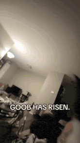 a living room with the words goob has risen on the bottom