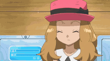 a girl wearing a pink hat is standing in front of a computer screen