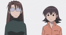 a couple of anime characters standing next to each other .
