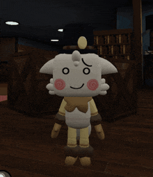 a stuffed animal with a swirl on its face is standing on a wood floor