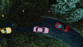 a group of cars are driving down a road