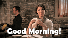 a woman sitting at a table with a cup of coffee and the words " good morning " on the bottom