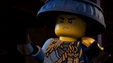 a close up of a lego character with a surprised expression
