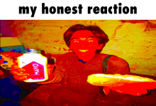 a person is holding a bottle of mayonnaise and a hot dog