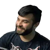 a man with a beard is wearing a black shirt that says ' nightmare ' on it