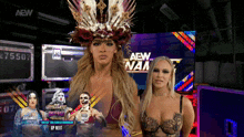 two women standing in front of a aew logo