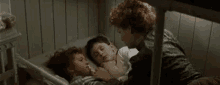 Mother Tucking Kids In GIF - Mothers Love Mom And Son Mom And Daughter GIFs
