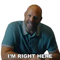 a man with a beard is smiling and says i 'm right here