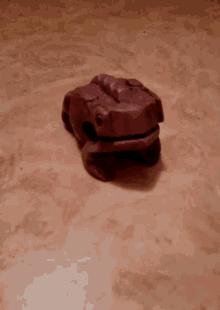 Grenouille Toy Frog GIF - Grenouille Toy Frog Brown Frog GIFs