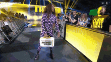 a woman in a purple pajama suit is carrying a briefcase that says money bank