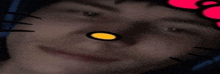 a close up of a person 's face with hello kitty on it