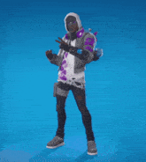 a man in a hoodie is dancing on a blue surface