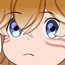 a close up of a girl 's face with a sad expression
