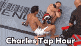 two men are fighting in a boxing ring and the words charles tap hour are on the bottom of the image .