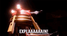 a robot with a rocket on top of it is saying explainaaain .