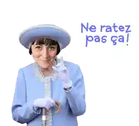 a woman in a blue coat and hat holds a cane and says ne ratez pas ca