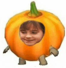 a person is wearing a pumpkin costume with a hole in the middle of it .