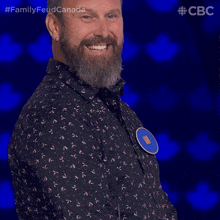 a man with a beard is wearing a badge that says jan