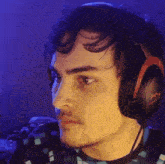a man wearing a pair of hyperx headphones