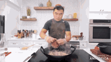 a man prepares food in a kitchen with the words made in animotica on the stove