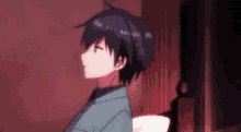 a man with purple hair is standing in a dark room with a red light behind him