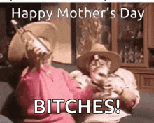a happy mother 's day greeting card with a man and woman sitting on a couch drinking wine