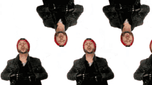 a man with a beard wearing a red hat is standing upside down