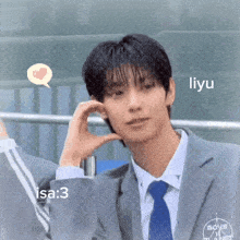 a young man in a suit and tie with the name liyu on the bottom