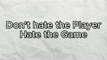 a piece of crumpled paper with the words " do n't hate the player hate the game " on it