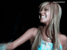 a woman in a blue dress is smiling with the hashtag anahioverdose at the bottom