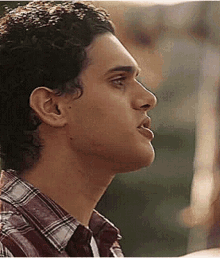 a close up of a man 's face with his mouth open .