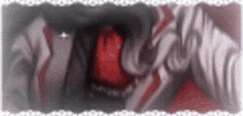 a close up of a person 's mouth with a red tongue and a white background .