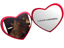 a heart shaped mirror with a picture of a man and the words i love hannibal