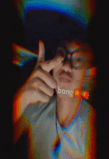 a blurry picture of a person with bang written on his face