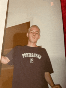 a man wearing a shirt that says portishead