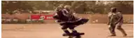 a blurred image of a person dancing in front of an airtel sign