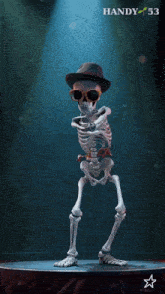 a skeleton wearing a hat and sunglasses is dancing on a stage with handy 53 written above him