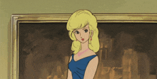 a woman in a blue dress is standing in front of a framed picture