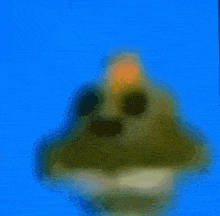a blurred image of a cartoon character with a blue background