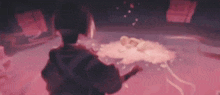 a person is standing in a room with a pink light coming out of it .