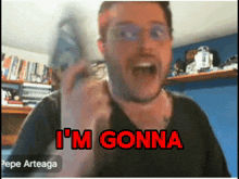 a man says i 'm gonna while holding a remote